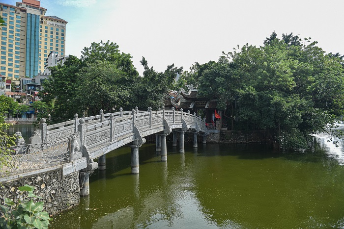 A bridge leads into Tran Quoc pagoda near Truc Bach Lake